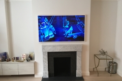 TV-wall-mounted-above-fireplace